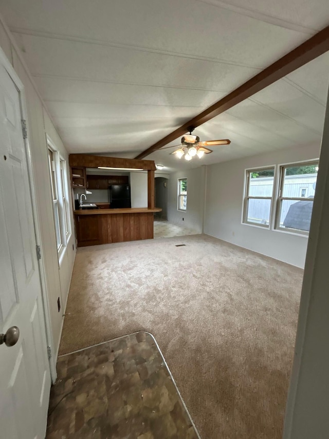 110 E Hickory Grove Rd Unit 45, Urbana, OH 43078 - unfurnished living room featuring carpet flooring, beam ceiling, and ceiling fan