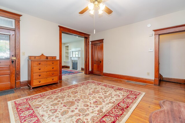 1366 S 4th St, Columbus, OH 43207 - foyer entrance featuring hardwood / wood-style flooring, a ceiling fan, and a fireplace