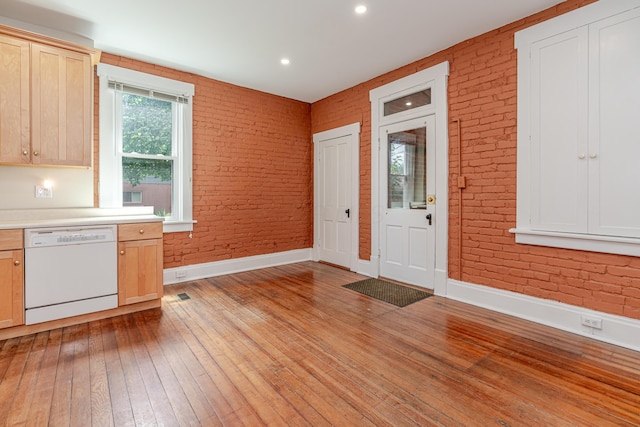 1366 S 4th St, Columbus, OH 43207 - foyer entrance featuring brick wall, light wood finished floors, and recessed lighting