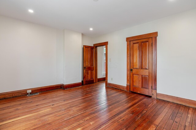 1366 S 4th St, Columbus, OH 43207 - spare room featuring hardwood / wood-style floors and recessed lighting