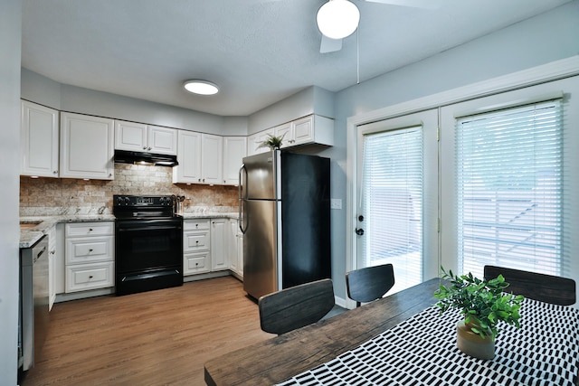 1820 Willoway Cir S, Columbus, OH 43220 - kitchen with appliances with stainless steel finishes, under cabinet range hood, healthy amount of natural light, and decorative backsplash
