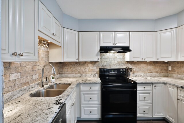 1820 Willoway Cir S, Columbus, OH 43220 - kitchen with black / electric stove, under cabinet range hood, white cabinets, decorative backsplash, and light stone countertops