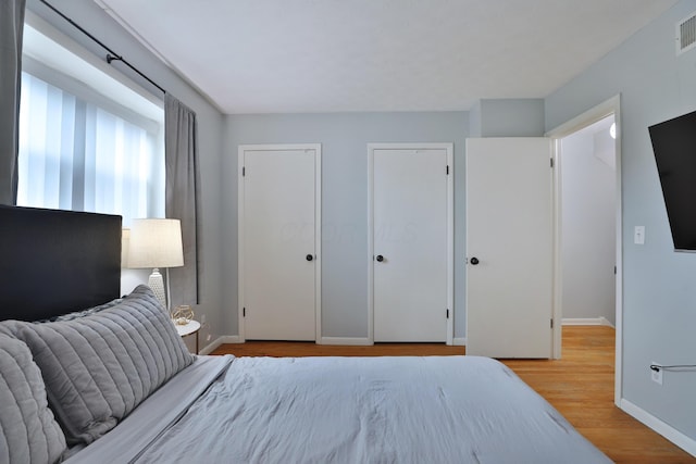 1820 Willoway Cir S, Columbus, OH 43220 - bedroom featuring wood finished floors and two closets