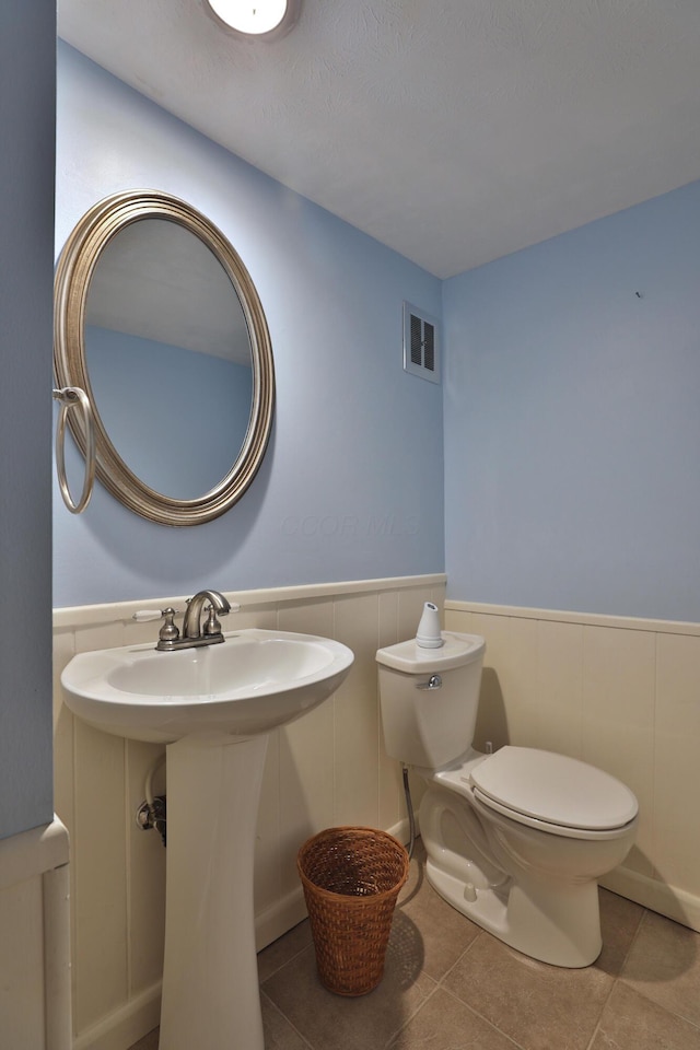 1820 Willoway Cir S, Columbus, OH 43220 - half bathroom featuring a wainscoted wall and tile patterned floors