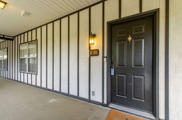 6065 Craughwell Ln, Dublin, OH 43017 - entrance to property featuring covered porch and board and batten siding