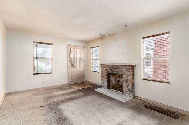 178 S Weyant Ave, Columbus, OH 43213 - unfurnished living room featuring carpet and a fireplace