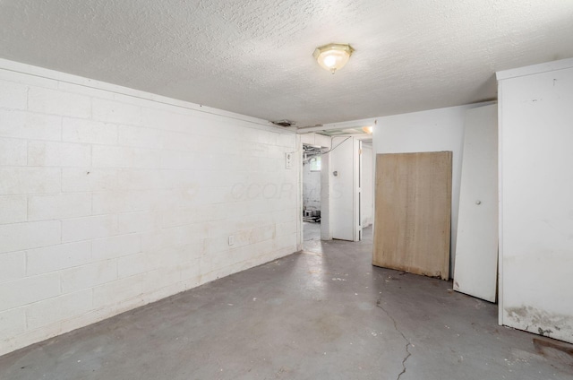 178 S Weyant Ave, Columbus, OH 43213 - below grade area featuring concrete block wall and a textured ceiling