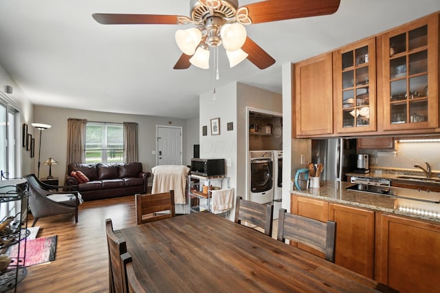 3063 Jersey Dr Unit 67, Columbus, OH 43204 - dining area with washer and clothes dryer, ceiling fan, and wood finished floors