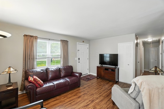 3063 Jersey Dr Unit 67, Columbus, OH 43204 - living room featuring attic access and wood finished floors