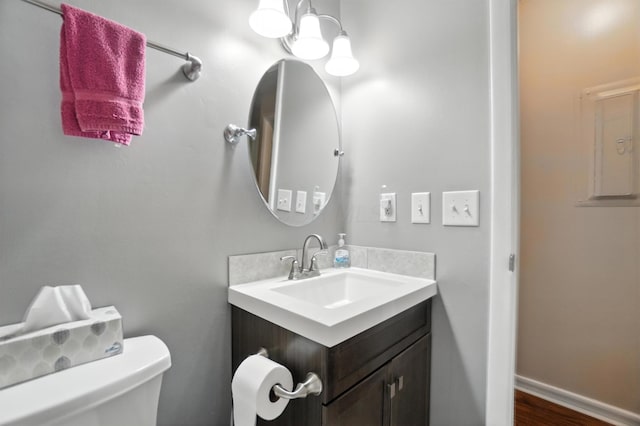 3063 Jersey Dr Unit 67, Columbus, OH 43204 - half bath featuring vanity and wood finished floors
