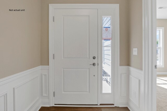 7641 Clifton Loop, Pickerington, OH 43147 - entryway with wainscoting, a decorative wall, and healthy amount of natural light
