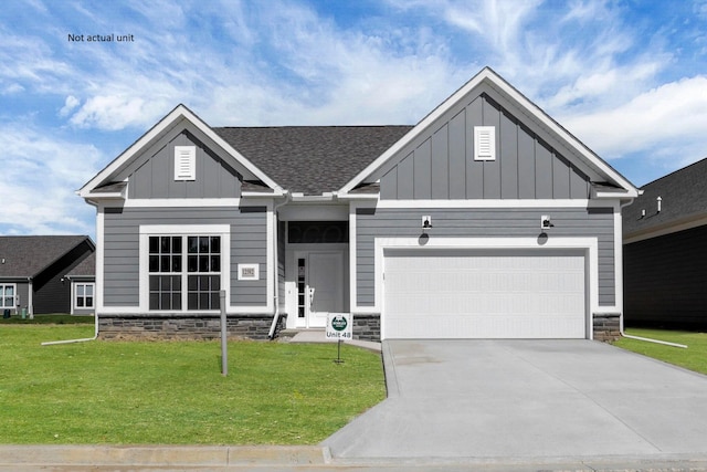 7641 Clifton Loop, Pickerington, OH 43147 - view of front of property with stone siding, board and batten siding, a front lawn, and driveway