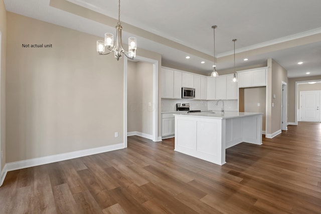 7641 Clifton Loop, Pickerington, OH 43147 - kitchen with appliances with stainless steel finishes, a raised ceiling, backsplash, dark wood-style flooring, and recessed lighting