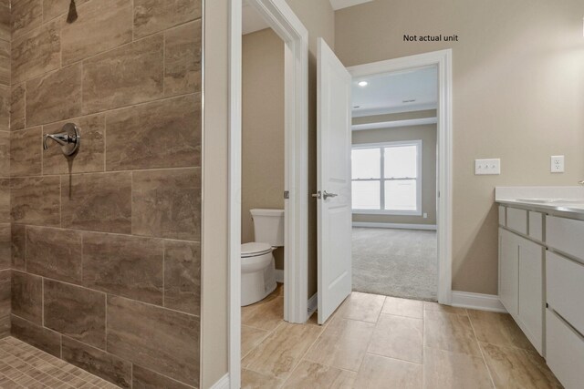 7641 Clifton Loop, Pickerington, OH 43147 - bathroom featuring a tile shower and vanity