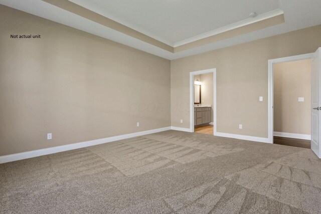 7641 Clifton Loop, Pickerington, OH 43147 - unfurnished bedroom featuring carpet floors, a tray ceiling, crown molding, and ensuite bathroom