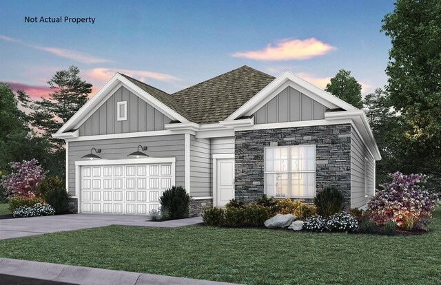 7641 Clifton Loop, Pickerington, OH 43147 - view of front facade featuring stone siding, board and batten siding, roof with shingles, and concrete driveway
