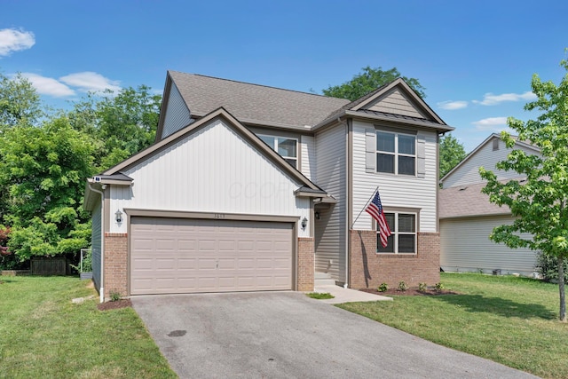 3615 Motts Place Ct, Canal Winchester, OH 43110 - view of front of property featuring brick siding, driveway, a front yard, and an attached garage