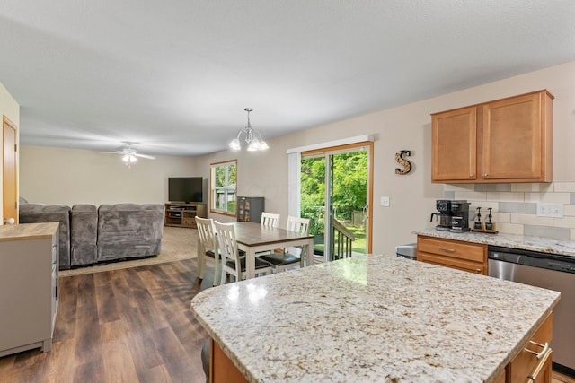 3615 Motts Place Ct, Canal Winchester, OH 43110 - kitchen featuring dishwasher, dark wood-style flooring, open floor plan, light stone counters, and a ceiling fan