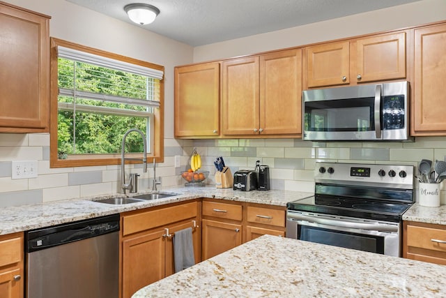 3615 Motts Place Ct, Canal Winchester, OH 43110 - kitchen with appliances with stainless steel finishes, tasteful backsplash, and light stone countertops