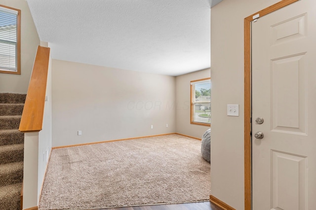 3615 Motts Place Ct, Canal Winchester, OH 43110 - unfurnished room with stairs, carpet, and a textured ceiling