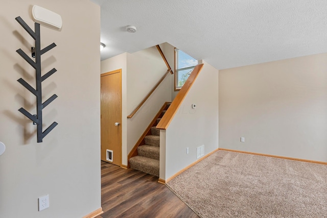 3615 Motts Place Ct, Canal Winchester, OH 43110 - stairs featuring a textured ceiling and wood finished floors