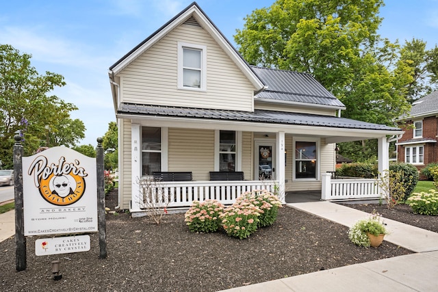 3615 Motts Place Ct, Canal Winchester, OH 43110 - view of front facade with covered porch and a metal roof