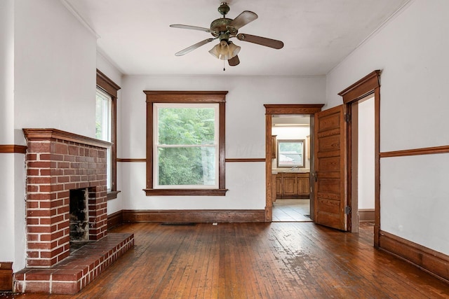 356 E 20th Ave, Columbus, OH 43201 - unfurnished living room with wood-type flooring, a ceiling fan, and a fireplace
