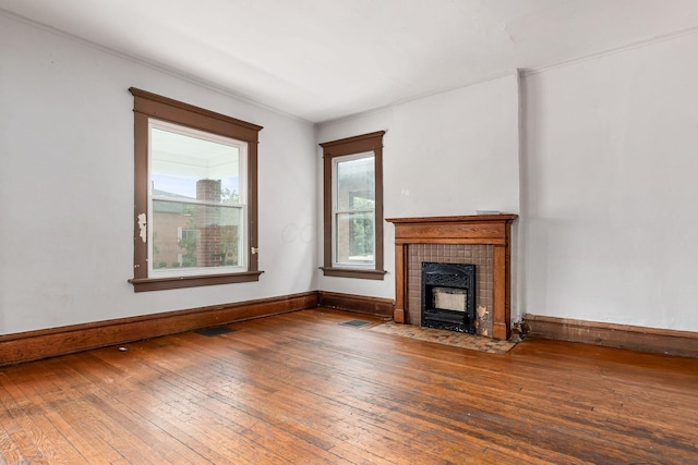 356 E 20th Ave, Columbus, OH 43201 - unfurnished living room with hardwood / wood-style floors and a fireplace