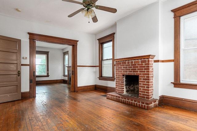 356 E 20th Ave, Columbus, OH 43201 - unfurnished living room featuring a brick fireplace, hardwood / wood-style floors, and ceiling fan