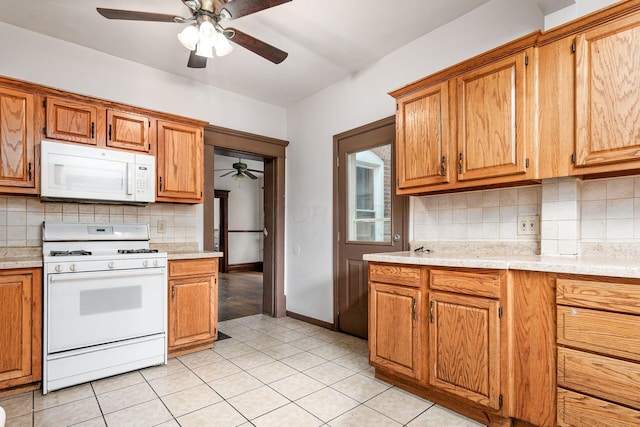 356 E 20th Ave, Columbus, OH 43201 - kitchen with white appliances, ceiling fan, light countertops, and tasteful backsplash