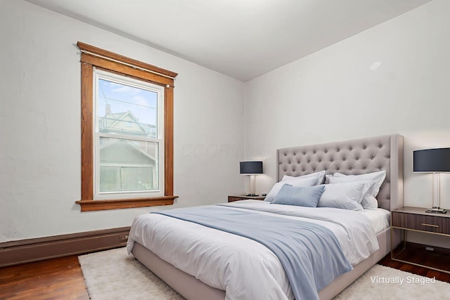 356 E 20th Ave, Columbus, OH 43201 - bedroom with wood finished floors and baseboard heating