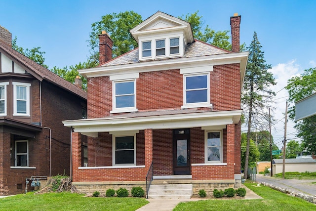 356 E 20th Ave, Columbus, OH 43201 - traditional style home with a chimney, brick siding, and a porch