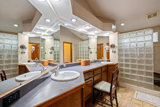 175 Academy Woods Dr, Columbus, OH 43230 - bathroom with walk in shower, double vanity, recessed lighting, and stone finish flooring