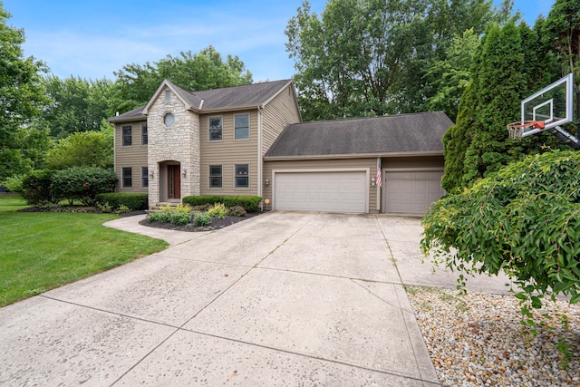 175 Academy Woods Dr, Columbus, OH 43230 - view of front facade with an attached garage, stone siding, a front lawn, concrete driveway, and roof with shingles