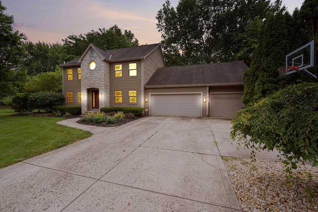 175 Academy Woods Dr, Columbus, OH 43230 - colonial home featuring stone siding, an attached garage, a front yard, concrete driveway, and roof with shingles