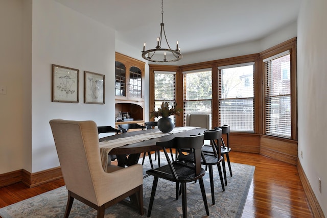 398 W 5th Ave, Columbus, OH 43201 - dining room featuring a chandelier, healthy amount of natural light, and wood finished floors