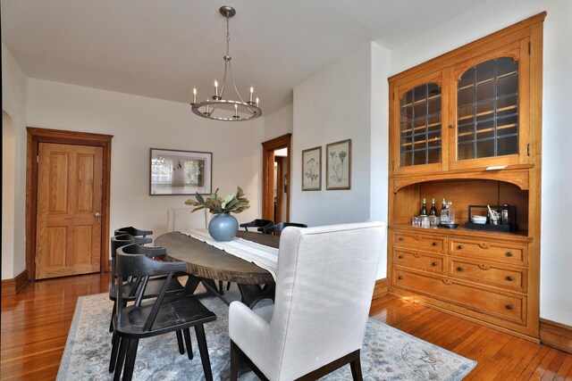 398 W 5th Ave, Columbus, OH 43201 - dining area featuring hardwood / wood-style flooring and a chandelier