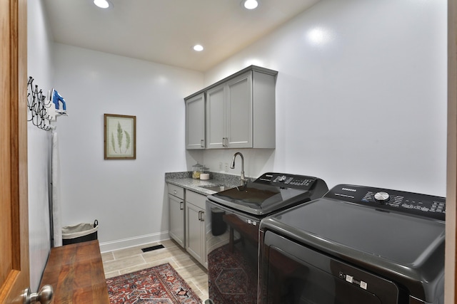 398 W 5th Ave, Columbus, OH 43201 - laundry room with washing machine and clothes dryer, cabinet space, and recessed lighting