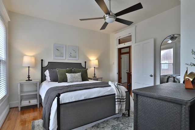398 W 5th Ave, Columbus, OH 43201 - bedroom featuring multiple windows, light wood-style floors, and a ceiling fan