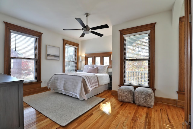 398 W 5th Ave, Columbus, OH 43201 - bedroom featuring wood finished floors, multiple windows, and a ceiling fan