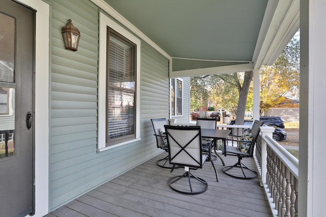 398 W 5th Ave, Columbus, OH 43201 - wooden porch featuring outdoor dining area