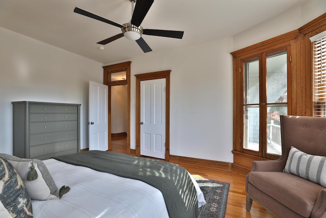 398 W 5th Ave, Columbus, OH 43201 - bedroom featuring multiple windows, light wood-type flooring, and ceiling fan