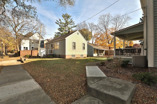 398 W 5th Ave, Columbus, OH 43201 - view of home's exterior featuring a central AC unit and a yard