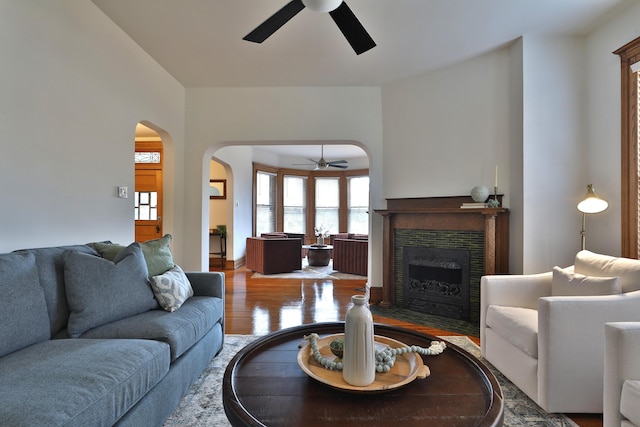 398 W 5th Ave, Columbus, OH 43201 - living area featuring ceiling fan, wood finished floors, a fireplace, and arched walkways