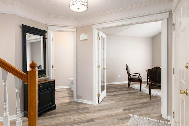6258 Tetlin Field Dr, New Albany, OH 43054 - corridor with light wood-style floors, stairway, and crown molding