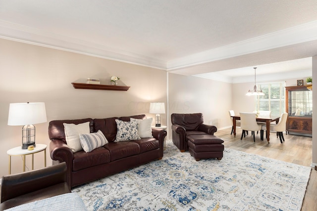 6258 Tetlin Field Dr, New Albany, OH 43054 - living room with wood finished floors, crown molding, and a chandelier