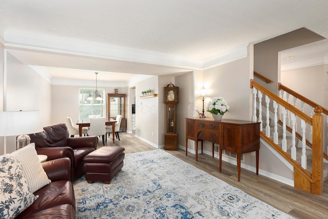 6258 Tetlin Field Dr, New Albany, OH 43054 - living room with wood finished floors, crown molding, and stairs