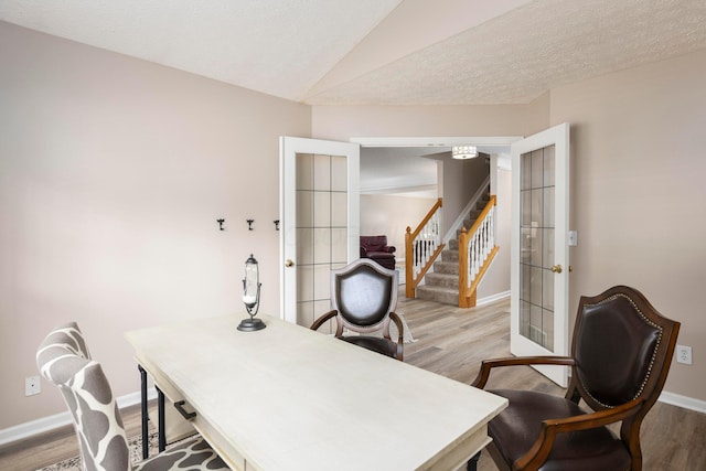 6258 Tetlin Field Dr, New Albany, OH 43054 - office space with french doors, light wood-style floors, a textured ceiling, and vaulted ceiling