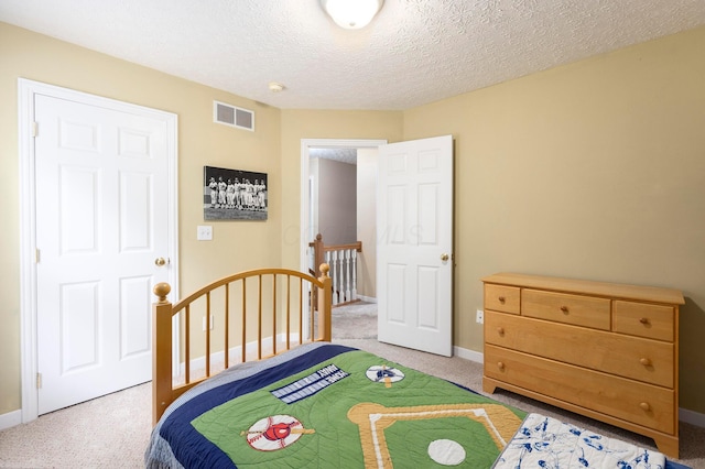 6258 Tetlin Field Dr, New Albany, OH 43054 - bedroom featuring light colored carpet and a textured ceiling