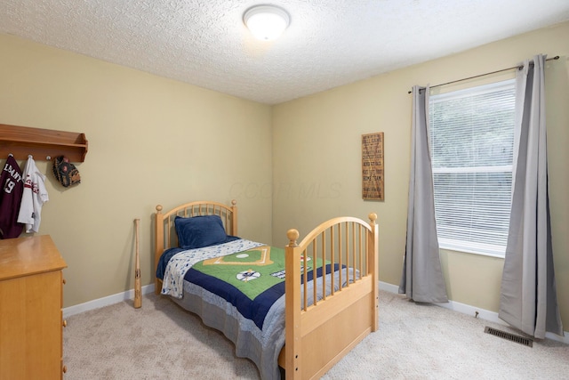 6258 Tetlin Field Dr, New Albany, OH 43054 - carpeted bedroom featuring a textured ceiling and baseboards